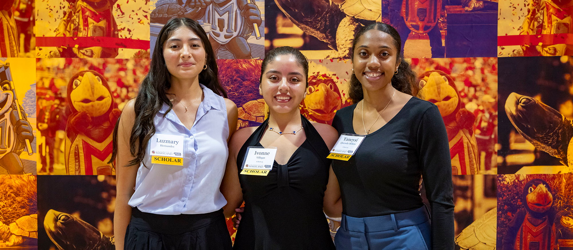 three students smiling in front of collage